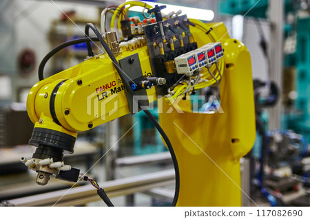 Industrial Robot Arm in Factory Setting Close-Up 117082690