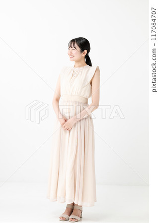 Young woman wearing a dress 117084707