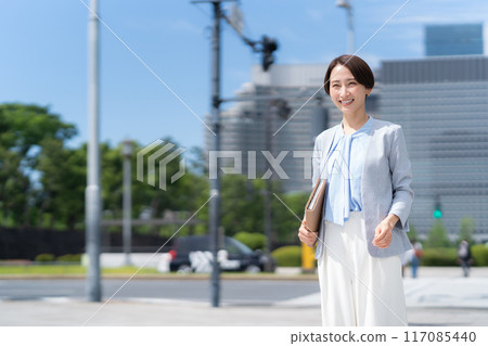 Middle-aged business woman working in an office district 117085440