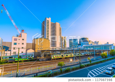 Fujisawa cityscape in Japan in July. View of Tsujido Station on the Tokaido Main Line, trains, and the orange and green Shonan colors of the line = 21st Fujisawa cityscape in Japan in July. View of Tsujido Station on the Tokaido Main Line, trains, and the orange and green Shonan colors of the line = 21st 117087398