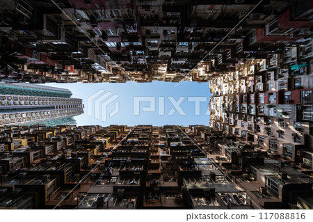 Yick Fat Building, Quarry Bay, Hong Kong. Residential area in old apartment with windows. High-rise building, skyscraper with windows of architecture in urban city. 117088816