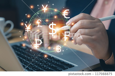 Business man with laptop. Online banking interbank payment. Business people hold a pen pressing virtual global currency symbols. Money transfers and currency exchanges between countries of the world. 117088875