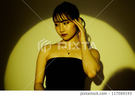 Female portrait using light and shadow color lighting 117089193