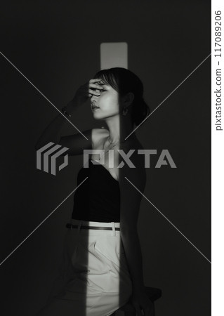 Female portrait in light and shadow Female portrait in light and shadow 117089206