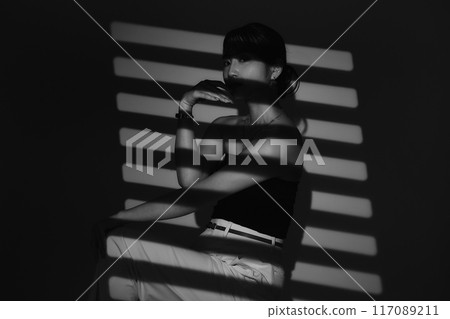Female portrait in light and shadow Female portrait in light and shadow 117089211