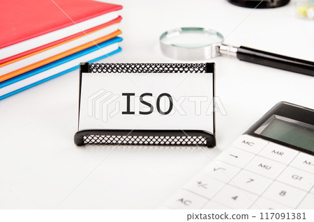 ISO service concept. ISO on a business card in a stand on a white background ISO service concept. ISO on a business card in a stand on a white background 117091381