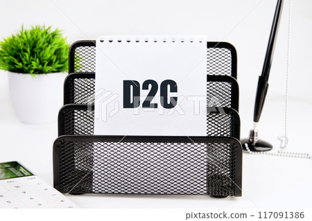 Concept of D2C Direct to customer, word D2C on a piece of paper on a white background Concept of D2C Direct to customer, word D2C on a piece of paper on a white background 117091386