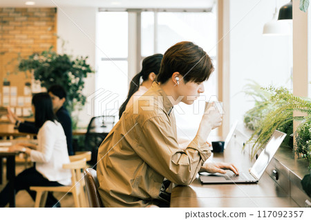 People working in a shared office 117092357