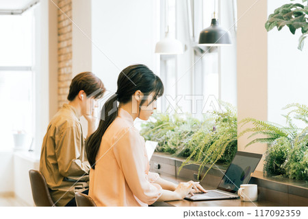 People working in a shared office People working in a shared office 117092359