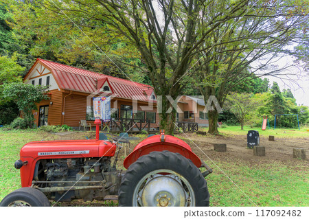 A shop building and a farm and tractor scene with a clear autumn sky in the background, "Yamada Family Farm Milk Village," Nishihara Village, Aso District 117092482