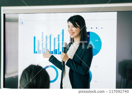 A woman giving a presentation A woman giving a presentation 117092740