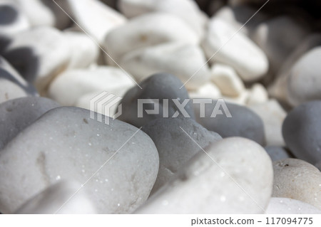 Decorative stones in the rays of sunlight 117094775