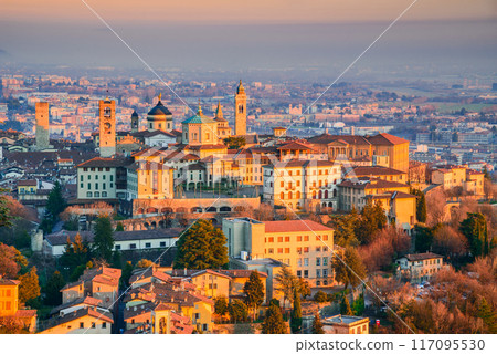 Bergamo, Italy - Sunset aerial view of Citta Alta beautiful historical town in Lombardy, Lombardia. Bergamo, Italy - Sunset aerial view of Citta Alta beautiful historical town in Lombardy, Lombardia. 117095530