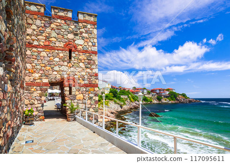Sozopol, Bulgaria. Summertime travel landscape with ancient walls of Apollonia and Black Sea rocky coastline. 117095611