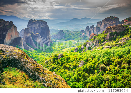 Meteora, Greece. Monastery of Roussanou in historical Thessaly, famous sandstone rock formations, world Greek heritage. 117095634