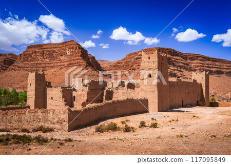 High Atlas, Morocco. Ancient ruined clay built kasbah in Ziz Valley canyon, North Africa. High Atlas, Morocco. Ancient ruined clay built kasbah in Ziz Valley canyon, North Africa. 117095849