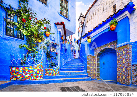 Chefchaouen, Morocco. Blue medina, ancient city, staircase and wall decorated with colourful flowerpots. 117095854