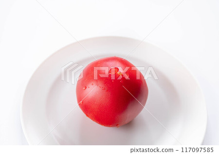 Tomatoes on a white plate Tomatoes on a white plate 117097585