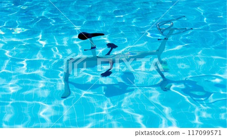 Metal exercise bike in the pool underwater for aerobic exercise Metal exercise bike in the pool underwater for aerobic exercise 117099571