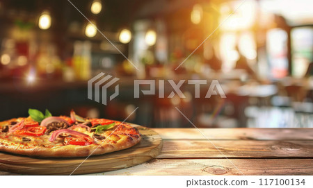 Close-up of fresh baked Italian pizza on old rustic wooden table in pizzeria background with bokeh 117100134