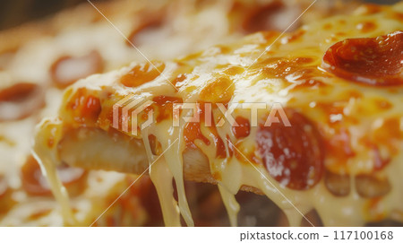 Close-up of fresh baked Italian Margherita pizza slice with oozing cheese 117100168