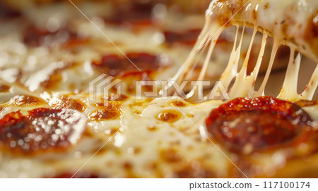 Close-up of fresh baked Italian Margherita pizza slice with oozing cheese 117100174