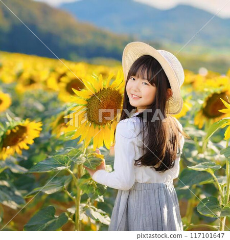 向日葵田裡戴著草帽的女人 117101647