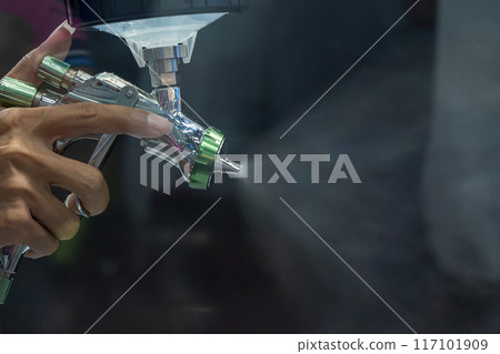 Close up scene the hand spray painting method by professional operator. Close up scene the hand spray painting method by professional operator. 117101909