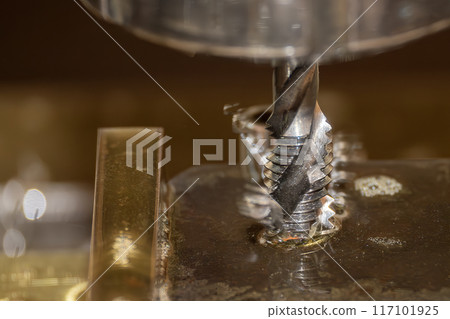 Close up scene the thread making process on metal plate. Close up scene the thread making process on metal plate. 117101925