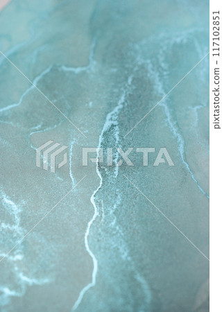 A close-up photograph of abstract teal and white swirls created through a liquid art process, capturing the beauty of flowing lines and vibrant color A close-up photograph of abstract teal and white swirls created through a liquid art process, capturing the beauty of flowing lines and vibrant color 117102851