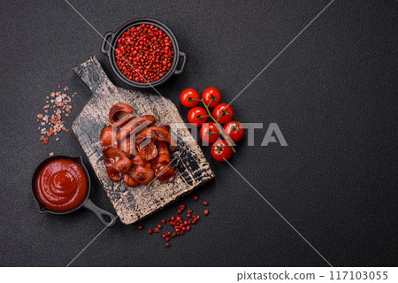 Fried sausages sliced with salt and spices as an ingredient for an English breakfast Fried sausages sliced with salt and spices as an ingredient for an English breakfast 117103055
