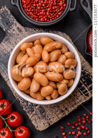 Delicious nutritious canned beans in tomato, with salt and spices Delicious nutritious canned beans in tomato, with salt and spices 117103077