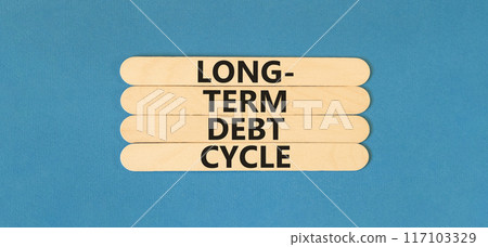 Long-term debt cycle symbol. Concept words Long-term debt cycle on wooden stick. Beautiful blue table blue background. Business Long-term debt cycle concept. Copy space. 117103329