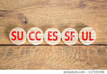 Successful symbol. Concept word Successful on beautiful wooden circles. Beautiful wooden background. Business successful concept. Copy space. 117103366