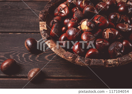 roasted chestnuts, in a wooden plate, top view, homemade, no people, roasted chestnuts, in a wooden plate, top view, homemade, no people, 117104054