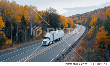 White semi truck on highway with vibrant fall foliage White semi truck on highway with vibrant fall foliage 117104341