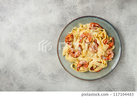 tagliatelli with shrimp, in cream sauce, with parmesan cheese, homemade, no people, in 117104483