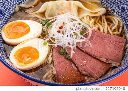 Portion of japanese ramen with pastrami and egg Portion of japanese ramen with pastrami and egg 117106048