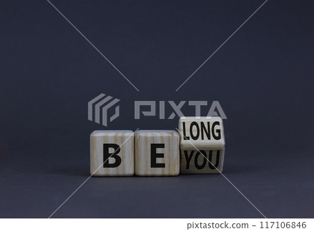 Be you, belong symbol. Turned a wooden cube and changed concept words 'be you' to 'belong'. Beautiful grey table grey background. Business, belonging and be you, belong concept. Copy space. Be you, belong symbol. Turned a wooden cube and changed concept words 'be you' to 'belong'. Beautiful grey table grey background. Business, belonging and be you, belong concept. Copy space. 117106846