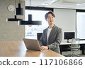 Japanese male businessman (talking to a colleague) 117106866