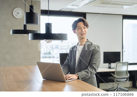 Japanese male businessman (talking to a colleague) Japanese male businessman (talking to a colleague) 117106866