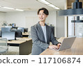 Japanese male businessman (talking to a colleague) 117106874