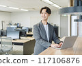Japanese male businessman (talking to a colleague) 117106876