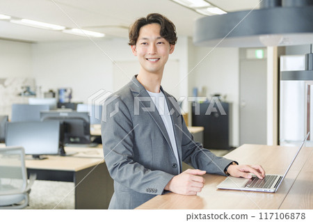 Japanese male businessman (talking to a colleague) Japanese male businessman (talking to a colleague) 117106878