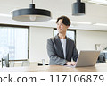 Japanese male businessman (talking to a colleague) 117106879