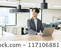 Japanese male businessman (talking to a colleague) 117106881