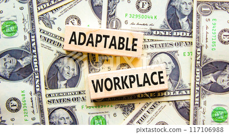 Adaptable workplace symbol. Concept words Adaptable workplace on beautiful wooden block. Beautiful dollar bills background. Dollar bills. Business Adaptable workplace concept. Copy space. 117106988