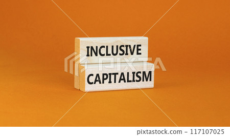 Inclusive capitalism symbol. Concept words Inclusive capitalism on beautiful wooden blocks. Beautiful orange table orange background. Business inclusive capitalism concept. Copy space. 117107025