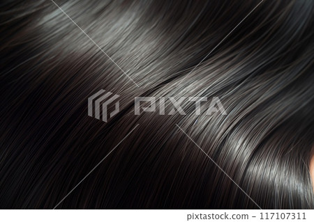 Detailed close-up shot showcasing the smooth texture of a woman's shiny, straight hair Detailed close-up shot showcasing the smooth texture of a woman's shiny, straight hair 117107311