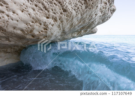 Waves Crashing on Rocks at Cala Luna 117107649